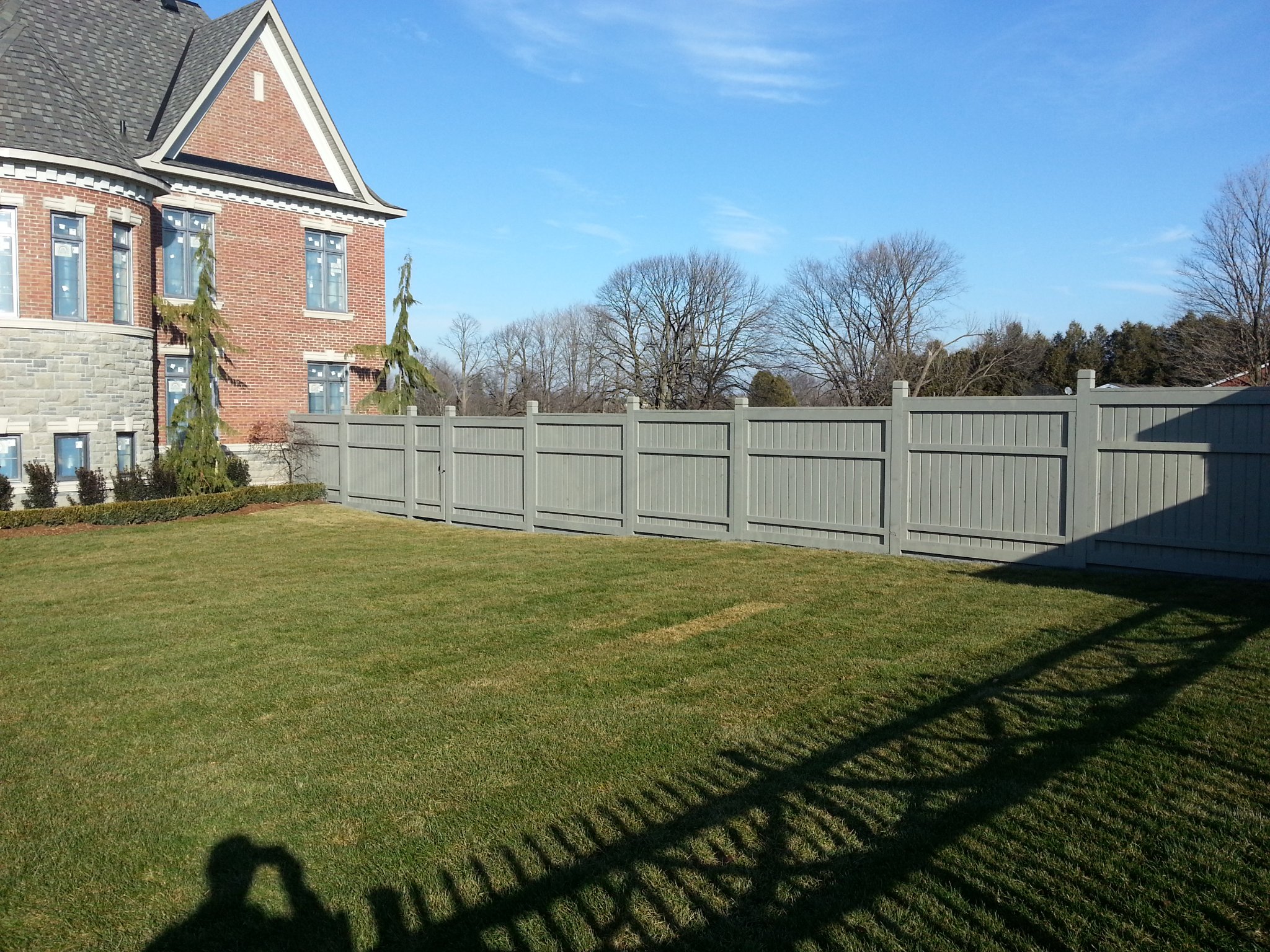Residential fence painting Vaughan - gray painted vinyl fence residential property